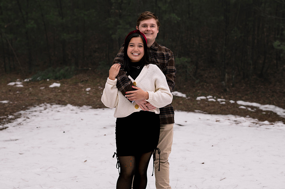 Couple posing playfully in the snow