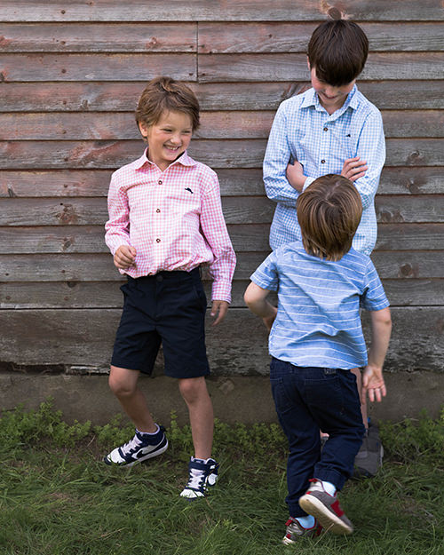 Children playing tag during family photoshoot